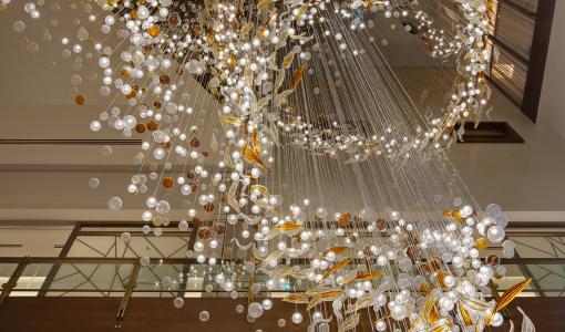 The movement of birds captured and translated into 3500 pieces of hand-blown glass installation: The Swoop
